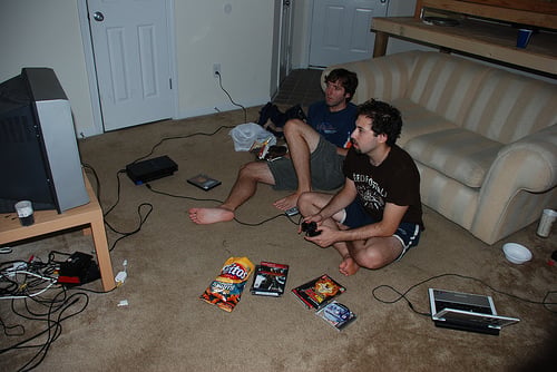 Living room and roommates playing PS2