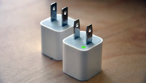 Front: New Apple power adapter, Back: Recalled adapter