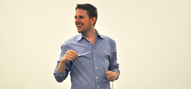 Matt Mullenweg holding a WordPress/WordCamp Town Hall