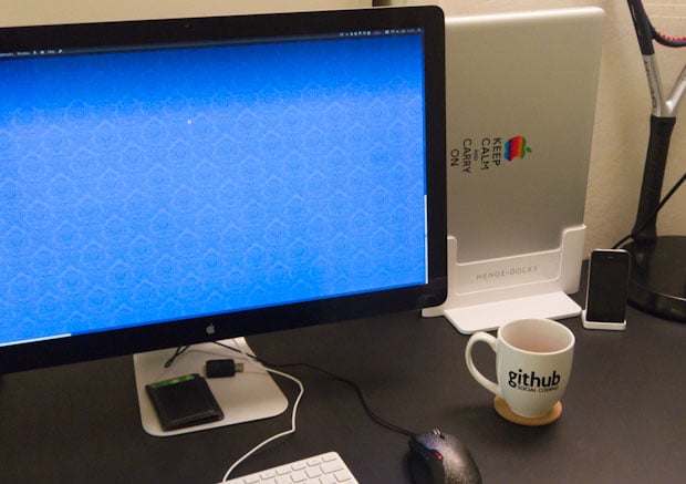 17-inch MacBook Pro and Apple LED Display on desk with Henge Docks