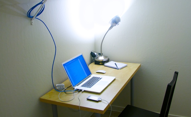 Desk setup with 17-inch MacBook Pro and Apple Magic Mouse