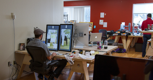 Erik Rose working with this dual vertical Apple Cinema Displays